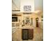 Finished wet bar with bar sink, granite countertops, wine cooler, and beverage storage at 29222 Can Do Ln, Tavares, FL 32778