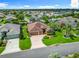 Bird's eye view displays the property's great curb appeal, landscaping, and proximity to neighborhood amenities at 2994 Adrienne Way, The Villages, FL 32163