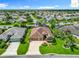 Beautiful aerial shot highlighting the home, its well-manicured lawn, and serene neighborhood at 2994 Adrienne Way, The Villages, FL 32163