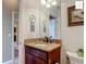 Bathroom featuring tiled floors and granite vanity at 2994 Adrienne Way, The Villages, FL 32163