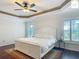Bedroom featuring a ceiling fan, plantation shutters, and hardwood floors at 2994 Adrienne Way, The Villages, FL 32163