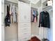 Walk-in closet with built-in shelving, drawers, and hanging rods for clothing storage at 2994 Adrienne Way, The Villages, FL 32163