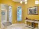 Welcoming foyer featuring tiled floors, a decorative window, and an elegant console table at 2994 Adrienne Way, The Villages, FL 32163