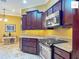 Well-appointed kitchen with granite countertops, stainless appliances, and plenty of counter space at 2994 Adrienne Way, The Villages, FL 32163
