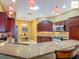 This bright kitchen features stainless appliances, granite countertops, and ample cabinet space at 2994 Adrienne Way, The Villages, FL 32163