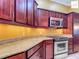 Modern kitchen features stainless steel appliances, granite countertops and stylish cabinetry at 2994 Adrienne Way, The Villages, FL 32163
