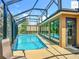 Sparkling pool under a screened enclosure with ample natural light at 2994 Adrienne Way, The Villages, FL 32163