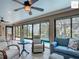 Bright sunroom overlooking the pool, with neutral finishes and inviting furniture at 2994 Adrienne Way, The Villages, FL 32163