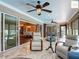 Cozy sunroom with neutral finishes, ceiling fan and access to the pool at 2994 Adrienne Way, The Villages, FL 32163