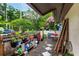 The backyard features a patio with potted plants and a garden area surrounded by foliage at 3015 Casselwood St, Winter Park, FL 32792