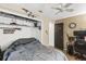 Bedroom featuring a ceiling fan, closet with shelving, and space for a computer desk at 3015 Casselwood St, Winter Park, FL 32792