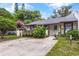 Charming single-story home with a well-manicured lawn and a cozy front entrance at 3015 Casselwood St, Winter Park, FL 32792