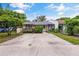 Inviting single-story home featuring a concrete driveway and a neatly landscaped front yard at 3015 Casselwood St, Winter Park, FL 32792