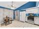 Bright kitchen features a breakfast table, stainless steel appliances, and ample storage at 3015 Casselwood St, Winter Park, FL 32792