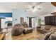 Open-concept living room featuring hardwood floors, cozy seating, and bright, airy space at 3015 Casselwood St, Winter Park, FL 32792