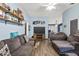 Bright living room with modern wood floors, cozy seating, and a large flat-screen television at 3015 Casselwood St, Winter Park, FL 32792