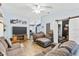 Spacious living room with hardwood floors, a ceiling fan, and comfortable seating at 3015 Casselwood St, Winter Park, FL 32792