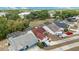 Aerial view of homes with screened pools in a lush community at 3016 Bloomsbury Dr, Kissimmee, FL 34747