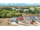 Aerial view of homes with screened pools in a lush community at 3016 Bloomsbury Dr, Kissimmee, FL 34747
