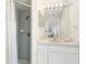 Bathroom with a shower, vanity, and sink, providing essential amenities for daily living at 3016 Bloomsbury Dr, Kissimmee, FL 34747