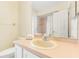Bathroom with a large mirror, a shower and a sink with vanity at 3016 Bloomsbury Dr, Kissimmee, FL 34747