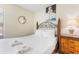 Cozy bedroom featuring a full-sized bed, nightstand, and a decorative lamp, perfect for relaxation at 3016 Bloomsbury Dr, Kissimmee, FL 34747