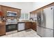 Well-equipped kitchen with stainless steel appliances, granite countertops, and ample cabinet space at 3016 Bloomsbury Dr, Kissimmee, FL 34747