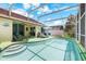 Inviting pool with sun loungers, table and chairs in a screened-in patio for relaxation and entertainment at 3016 Bloomsbury Dr, Kissimmee, FL 34747