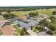 A beautiful neighborhood with private backyard pools, green spaces, and well-maintained lawns from an aerial view at 3128 Ibis Hill St, Clermont, FL 34714