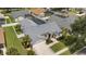 Aerial view of a single-Gathering home with a spacious backyard, enclosed pool, and well-maintained landscaping at 3128 Ibis Hill St, Clermont, FL 34714