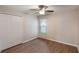 This bedroom has wood floors, neutral paint, ceiling fan, window, and a closet at 3128 Ibis Hill St, Clermont, FL 34714