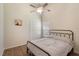 Bedroom with wood flooring, ceiling fan, neutral paint, window, and closet at 3128 Ibis Hill St, Clermont, FL 34714