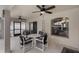 Enclosed patio featuring ceiling fans, neutral colors, a seating area, and access to a screen enclosed lanai at 3128 Ibis Hill St, Clermont, FL 34714