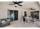 Covered patio featuring ceiling fans and a view of the sparkling pool beyond at 3128 Ibis Hill St, Clermont, FL 34714