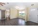The entryway has wood floors, a front door with glass, and a view to the breakfast nook at 31636 Gladys Ln, Tavares, FL 32778