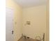 The laundry room has neutral walls and wood-look floors; ready for your washer and dryer at 31636 Gladys Ln, Tavares, FL 32778