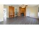 Bright living room features wood fireplace and wood-look floors at 31636 Gladys Ln, Tavares, FL 32778