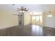 Living room featuring wood floors, barn door, bay window and front door at 31636 Gladys Ln, Tavares, FL 32778