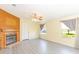 Inviting living room with wooden floors, a fireplace, and an abundance of natural light at 31636 Gladys Ln, Tavares, FL 32778