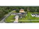 Charming single-story home features lush landscaping, screened porch, fenced pool and a well-manicured lawn at 318 Stone Castle Loop, Lady Lake, FL 32159
