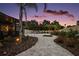Spacious backyard features pavers, landscaping, and an inviting outdoor space at 318 Stone Castle Loop, Lady Lake, FL 32159