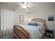 Light and airy bedroom features a ceiling fan and decorative accents at 318 Stone Castle Loop, Lady Lake, FL 32159