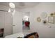 Bedroom with decor and an open doorway to living area and closet at 318 Stone Castle Loop, Lady Lake, FL 32159