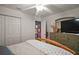 Cozy bedroom features a ceiling fan and neutral decor at 318 Stone Castle Loop, Lady Lake, FL 32159