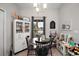 Eat-in dining area features natural light, a modern chandelier, and decor at 318 Stone Castle Loop, Lady Lake, FL 32159