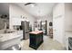 Bright kitchen features an island with butcher block top, stainless steel appliances, and vaulted ceiling at 318 Stone Castle Loop, Lady Lake, FL 32159