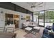 Relaxing screened patio with comfortable seating, and neutral decor at 318 Stone Castle Loop, Lady Lake, FL 32159