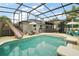Backyard pool with slide and umbrellas, great for summertime fun at 318 Stone Castle Loop, Lady Lake, FL 32159