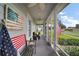 The home's screened in porch features seating to enjoy the outdoors at 318 Stone Castle Loop, Lady Lake, FL 32159