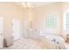 Well-lit bathroom showcasing a jetted tub, tiled floor, and a vanity, blending functionality and style at 32025 Timberlake Dr, Mount Dora, FL 32757